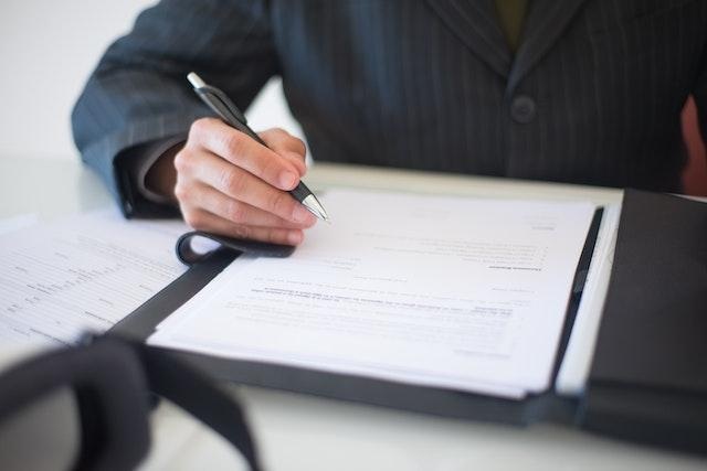 a man signing a document